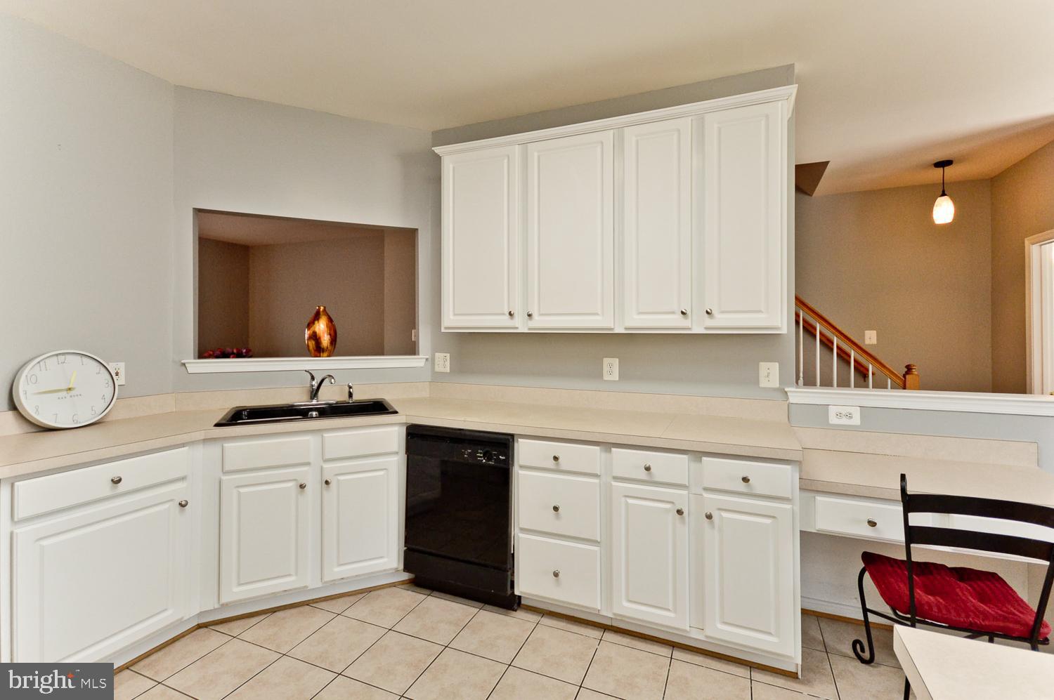 1113 Ring Bill Loop Upper Marlboro, MD 20774 - Photo 17 of 39 a kitchen with white cabinets appliances and sink