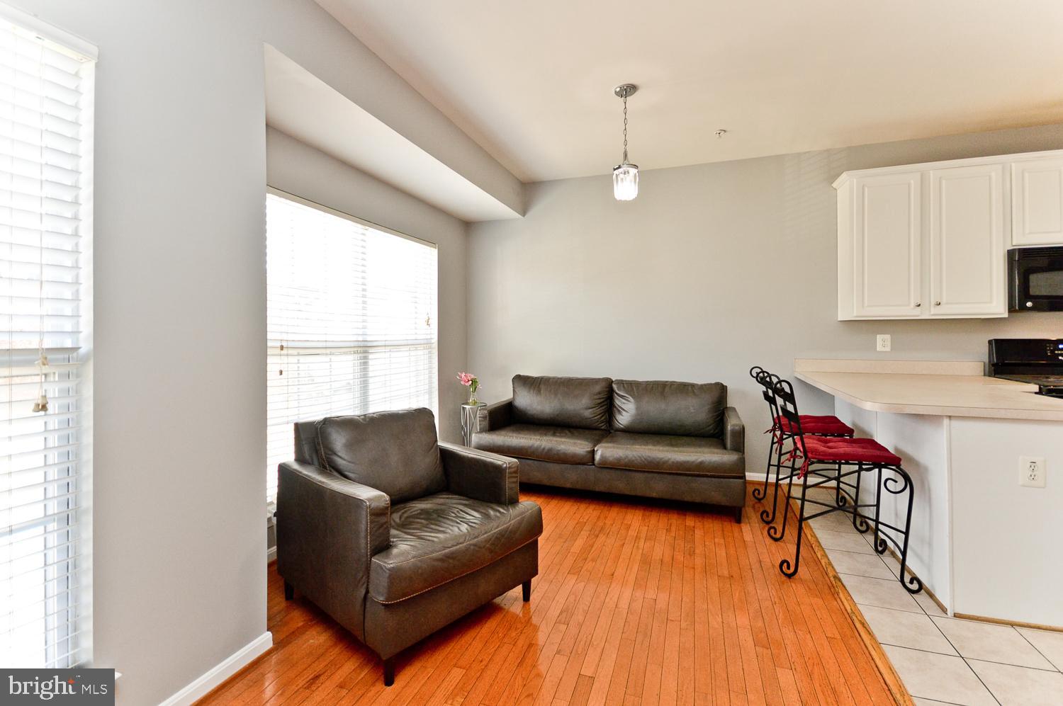 1113 Ring Bill Loop Upper Marlboro, MD 20774 - Photo 20 of 39 a living room with furniture and a wooden floor