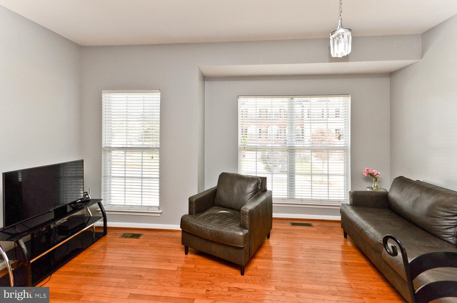 1113 Ring Bill Loop Upper Marlboro, MD 20774 - Photo 21 of 39 a living room with furniture and a flat screen tv