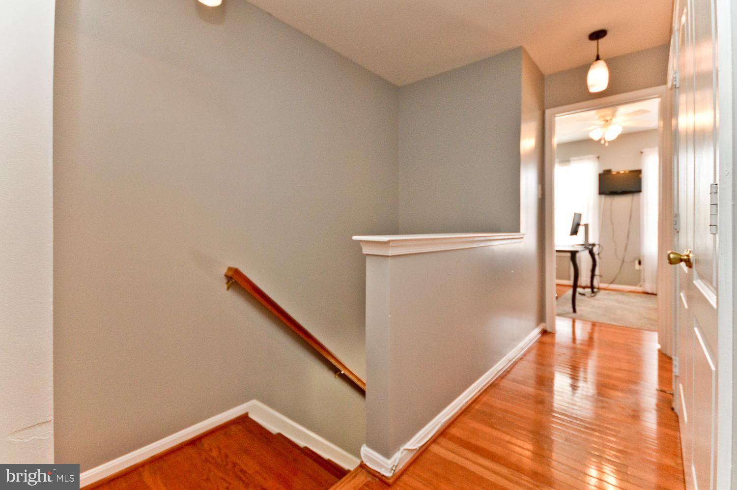1113 Ring Bill Loop Upper Marlboro, MD 20774 - Photo 24 of 39 a view of a hallway with wooden floor