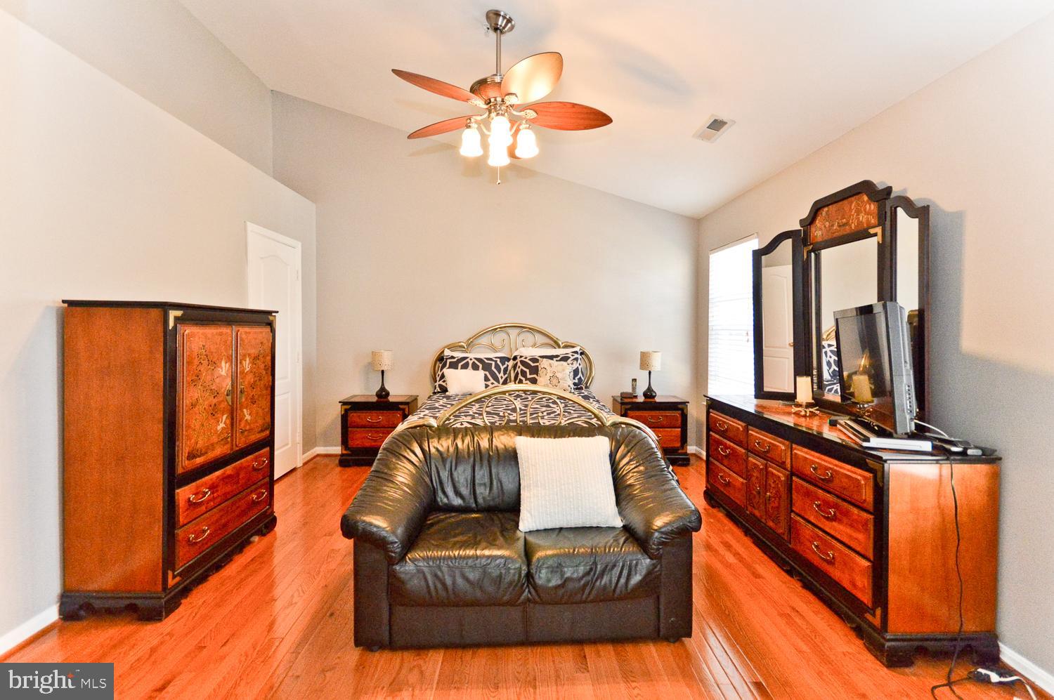 1113 Ring Bill Loop Upper Marlboro, MD 20774 - Photo 25 of 39 a bedroom with furniture and a large window