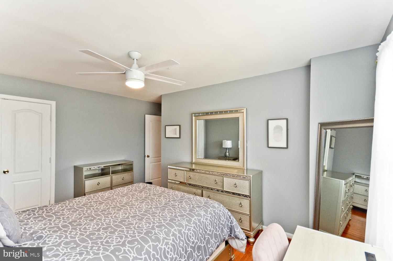 1113 Ring Bill Loop Upper Marlboro, MD 20774 - Photo 33 of 39 a bedroom with a bed and a dresser with mirror