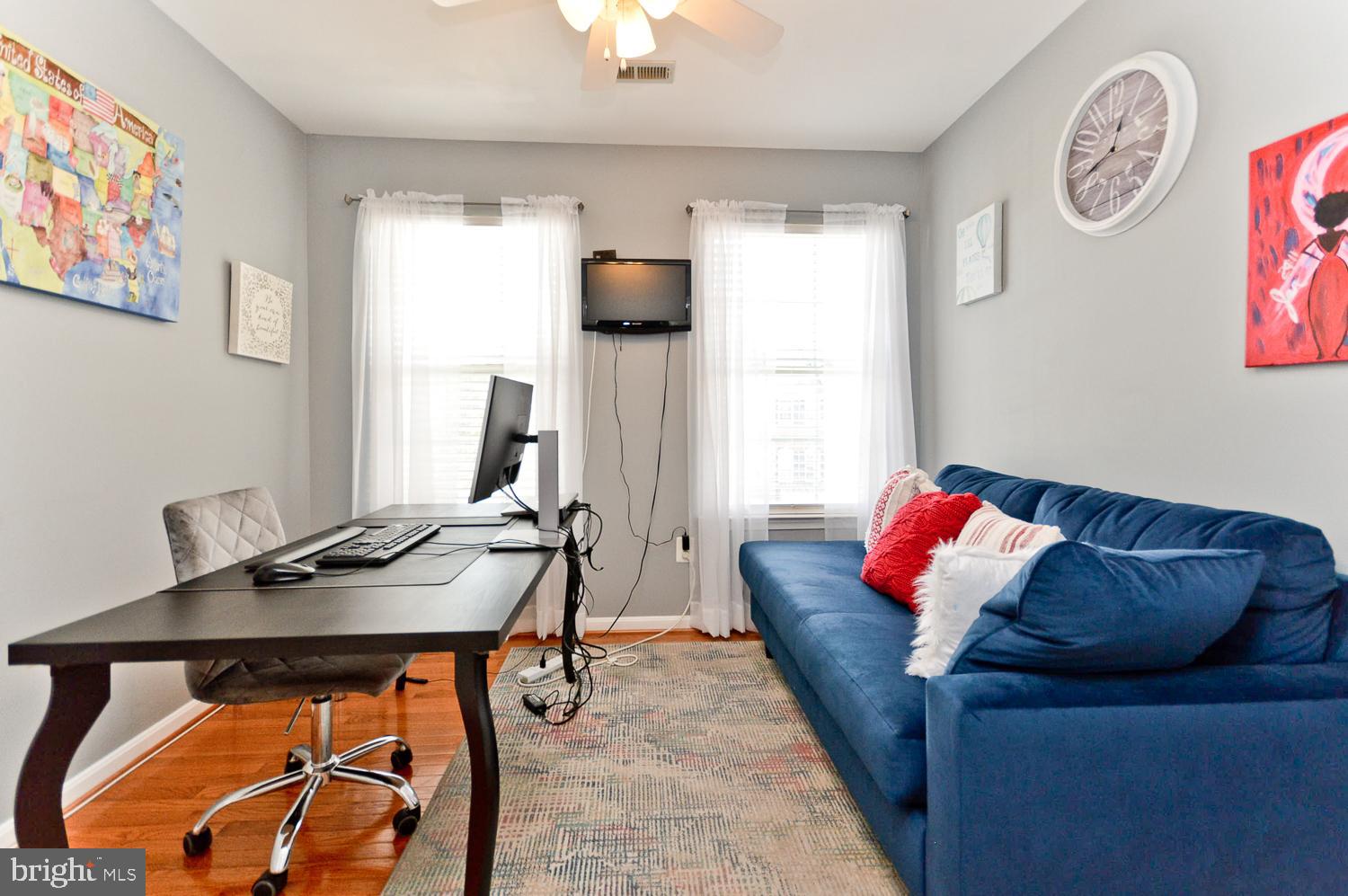 1113 Ring Bill Loop Upper Marlboro, MD 20774 - Photo 35 of 39 a living room with furniture and a flat screen tv