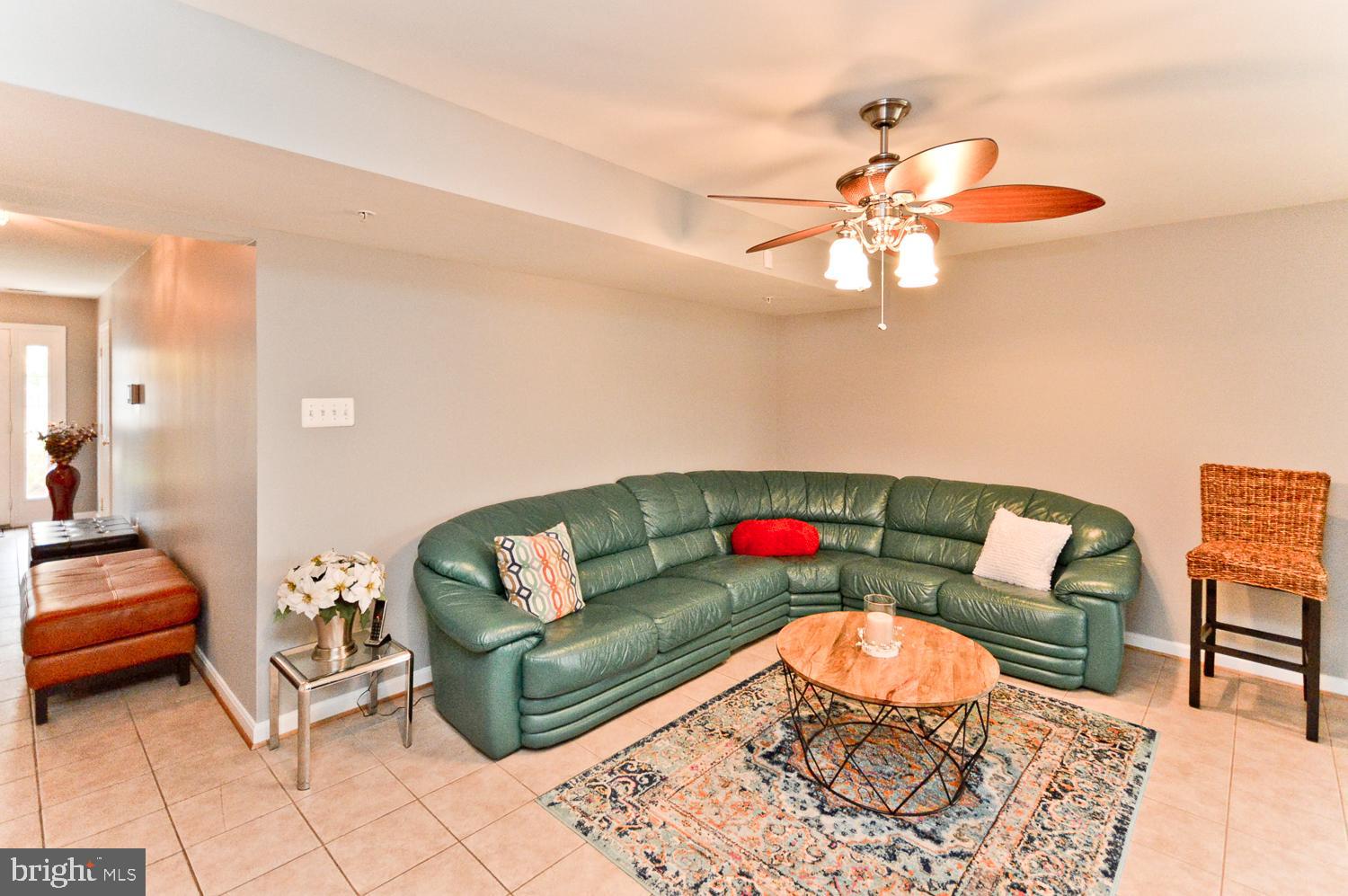 1113 Ring Bill Loop Upper Marlboro, MD 20774 - Photo 8 of 39 a living room with furniture and a chandelier