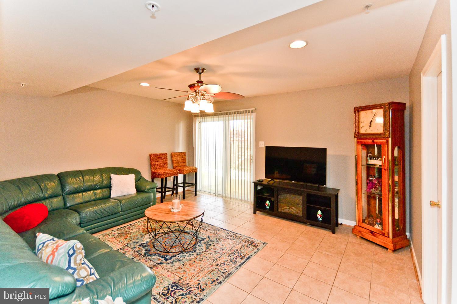 1113 Ring Bill Loop Upper Marlboro, MD 20774 - Photo 9 of 39 a living room with furniture and a flat screen tv