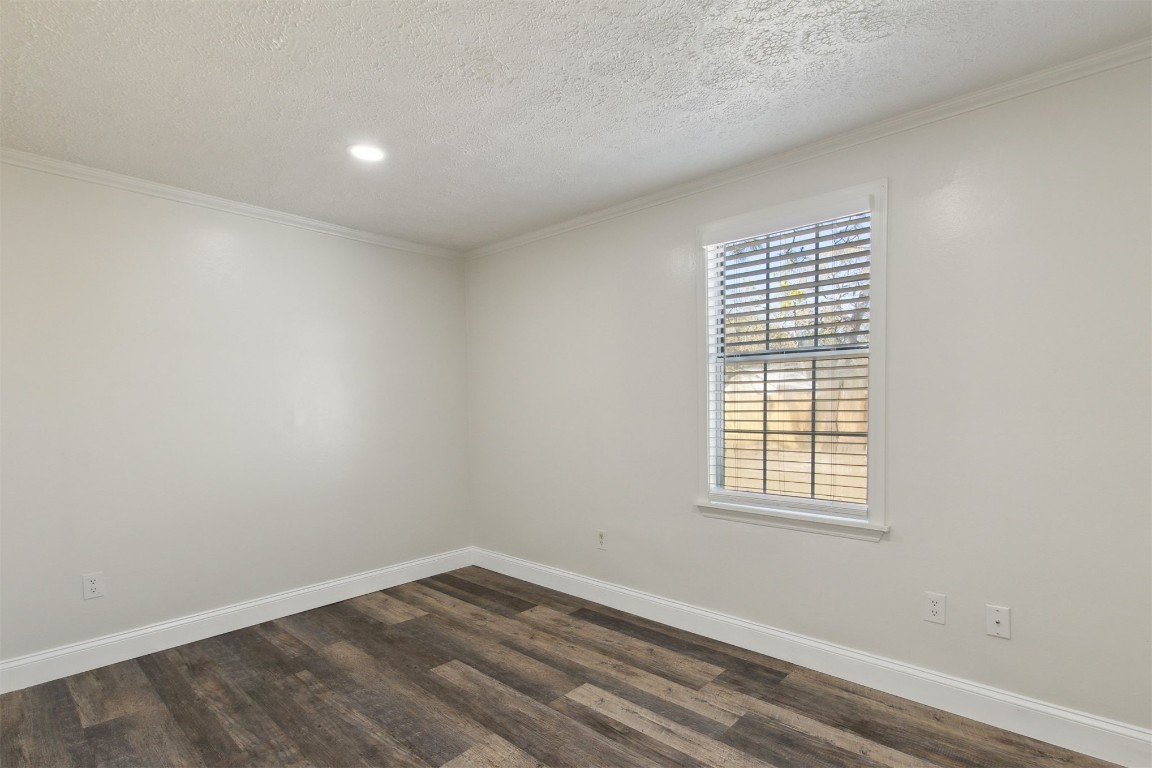 97119 Diamond Street Yulee, FL 32097 - Photo 20 of 23 an empty room with wooden floor and windows