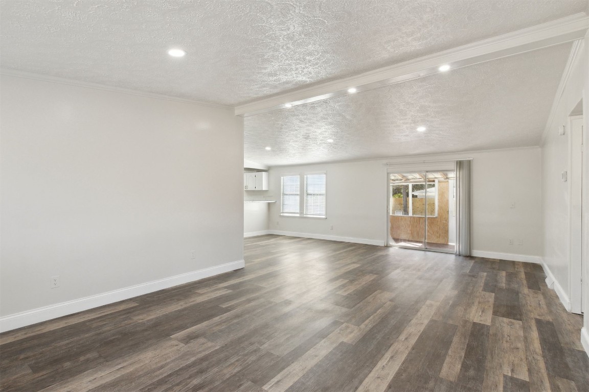 97119 Diamond Street Yulee, FL 32097 - Photo 7 of 23 a view of empty room with wooden floor and fan