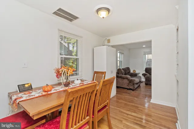a living room with furniture a rug and a table