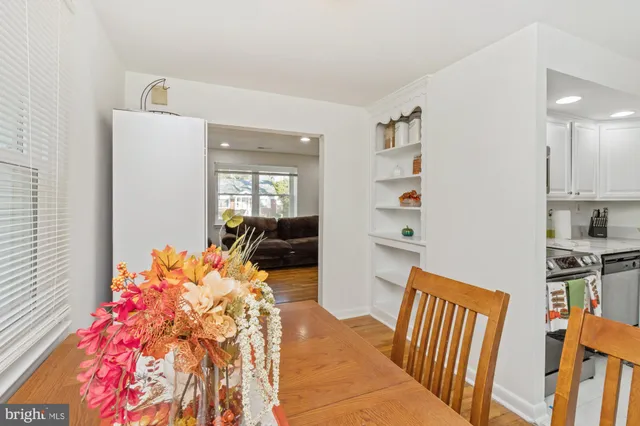 a bedroom with furniture and a book shelf