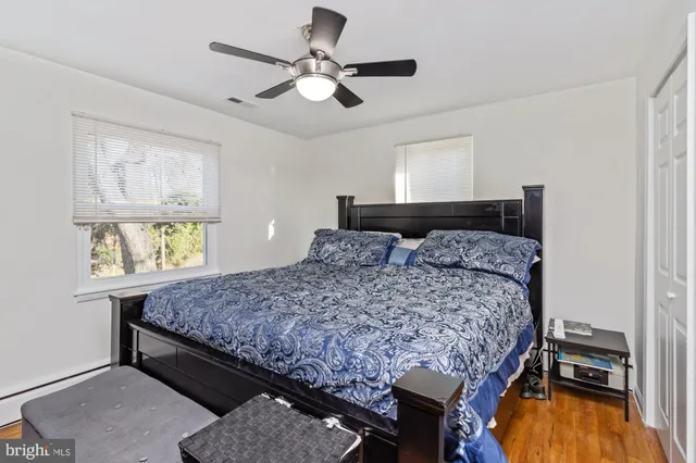 a bedroom with a bed and a television