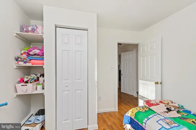 a view of a workspace with furniture and wooden floor