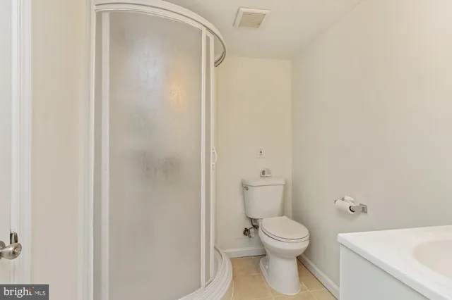 a view of a big room with closet and lounge chair