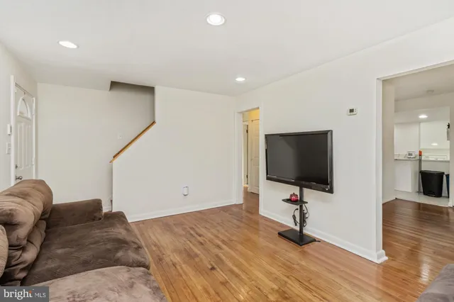a bedroom with furniture and a flat screen tv