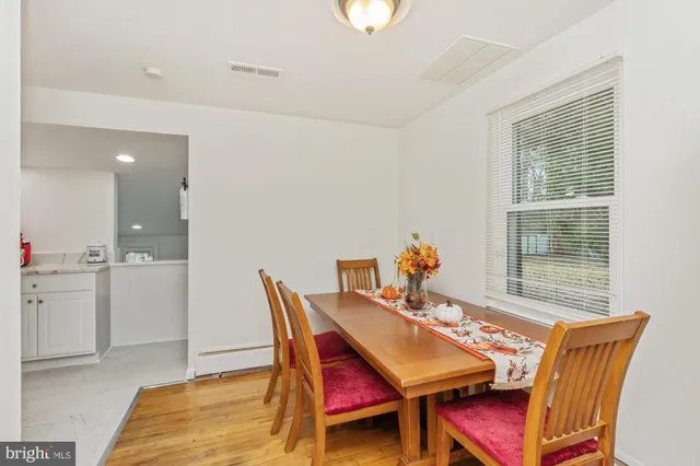 a view of a dining room with furniture and window