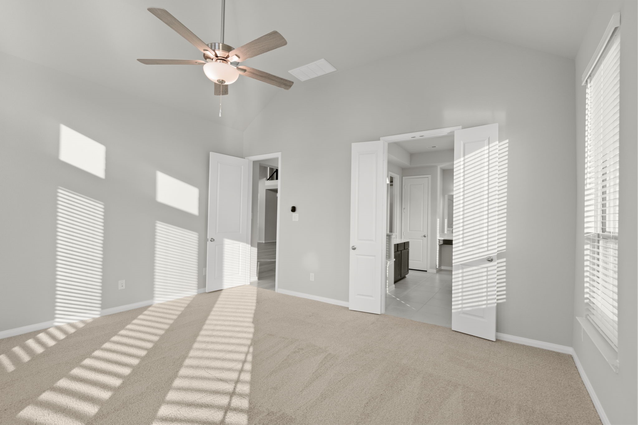 6402 Citron Elm Road Manvel, TX 77578 - Photo 19 of 37 a view of a room with a ceiling fan and a window