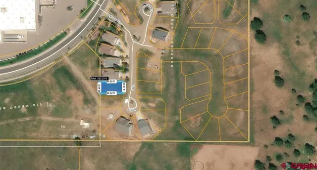 a view of a street with a building in the background