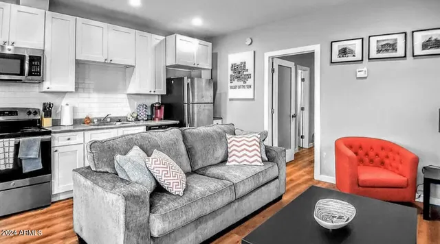 a living room with furniture and a window