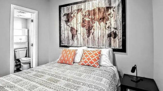 a bedroom with a bed and a closet