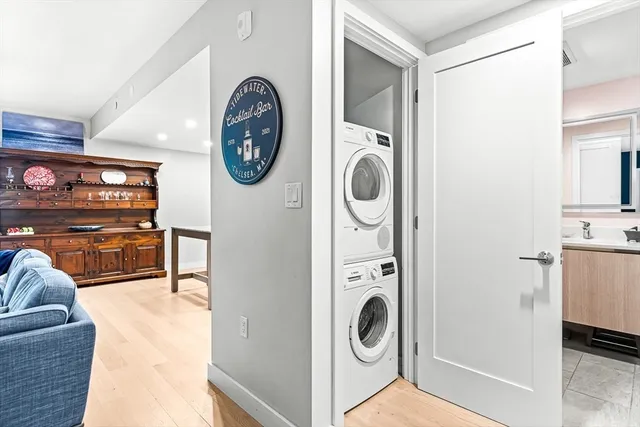 a view of a storage and utility room with washer and dryer