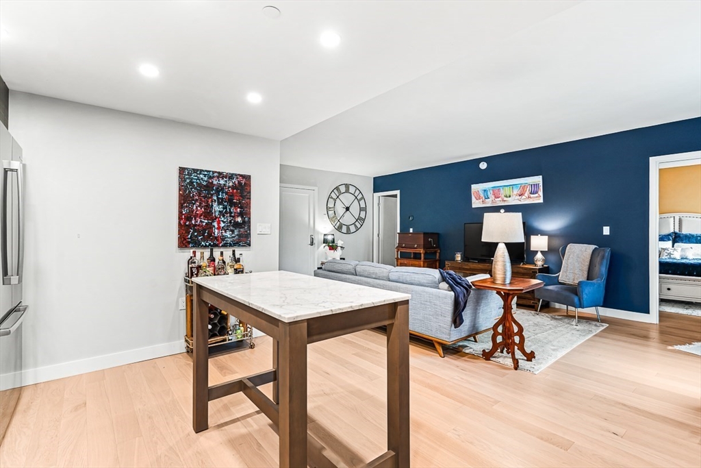932 Broadway, Unit 208 Chelsea, MA 02150 - Photo 13 of 25 a view of a workspace with furniture and a window