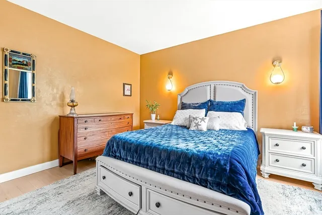 a bedroom with a bed and a dresser