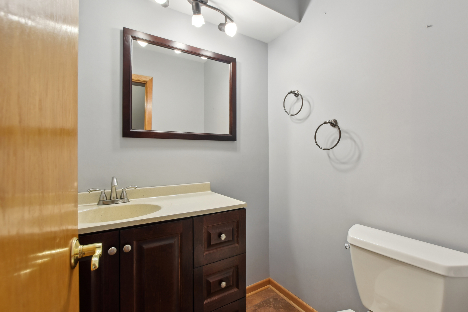 7N401 Stevens Road St. Charles, IL 60175 - Photo 13 of 33 a bathroom with a toilet sink vanity and mirror