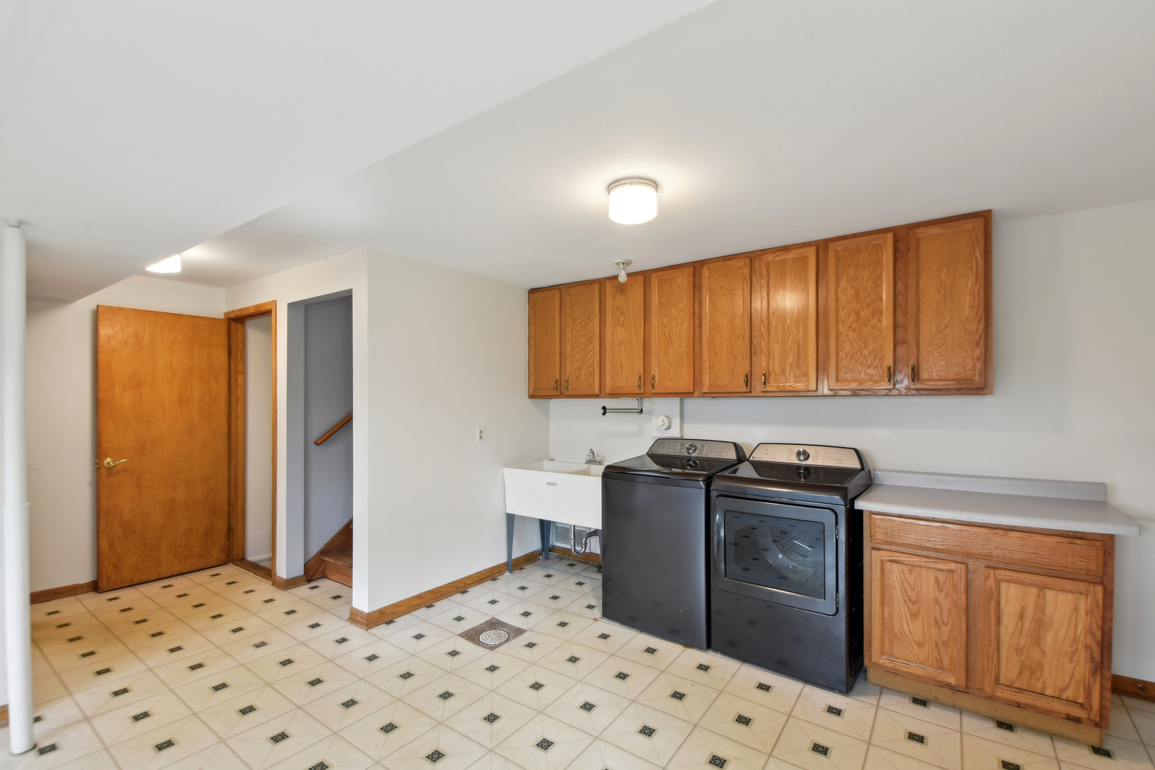 7N401 Stevens Road St. Charles, IL 60175 - Photo 23 of 33 a kitchen with granite countertop a sink cabinets and stainless steel appliances