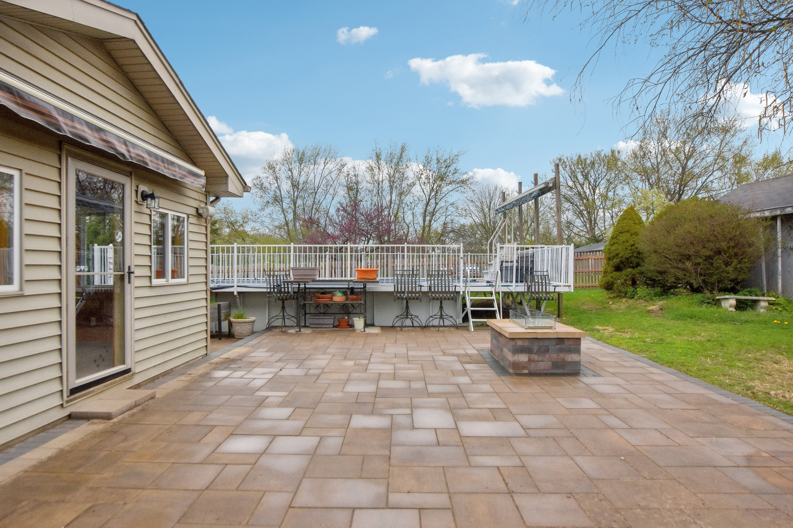 7N401 Stevens Road St. Charles, IL 60175 - Photo 27 of 33 a view of a chairs and fire pit in the back yard of the house