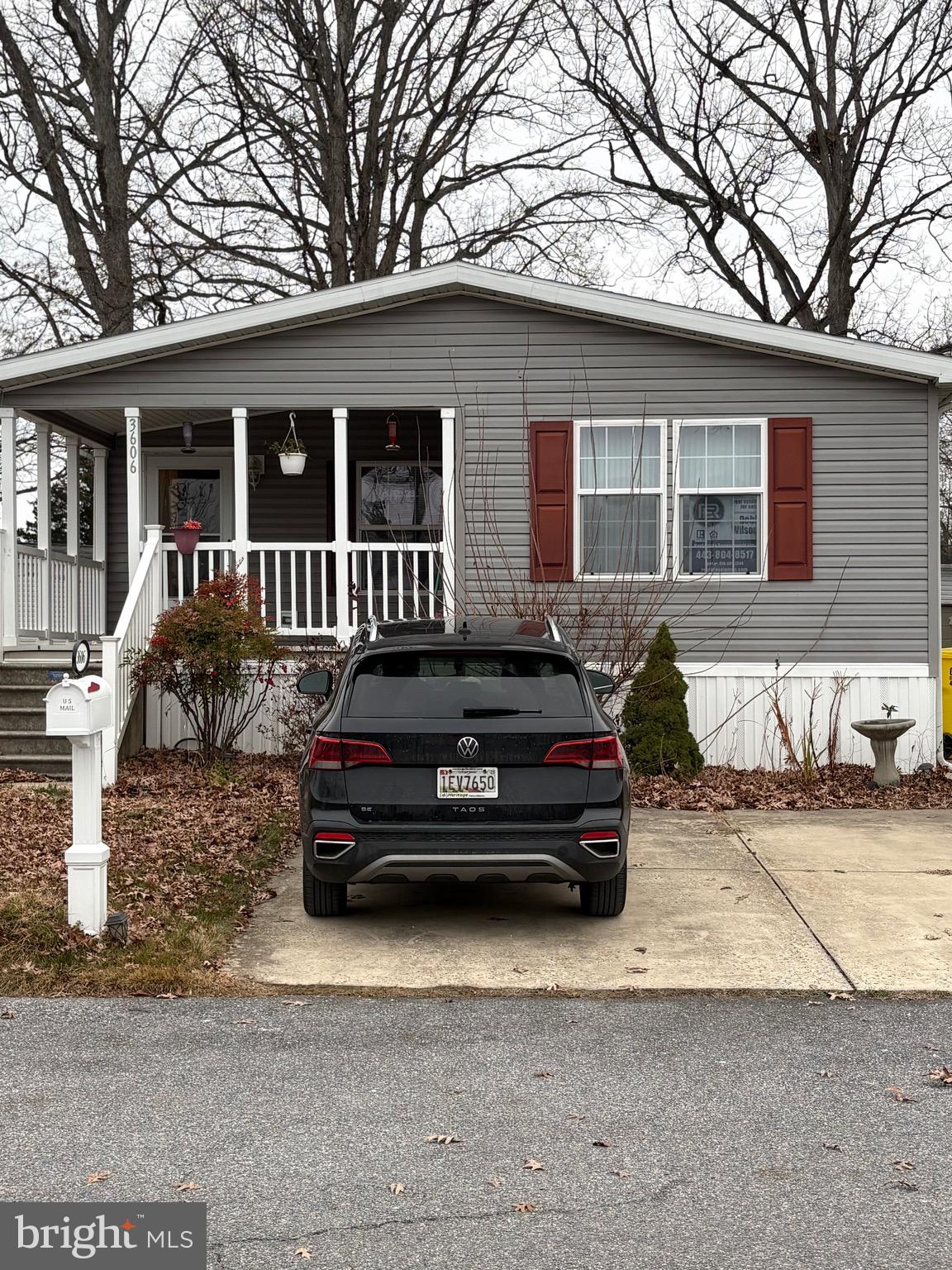 a car parked in front of a house