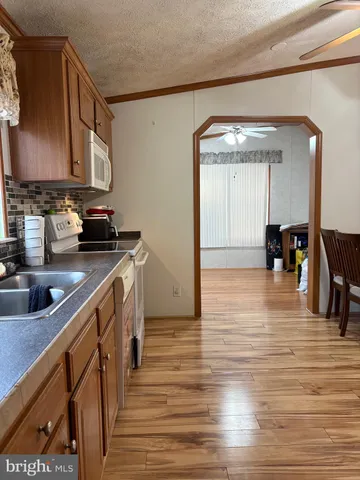 a kitchen with stainless steel appliances granite countertop a sink and cabinets