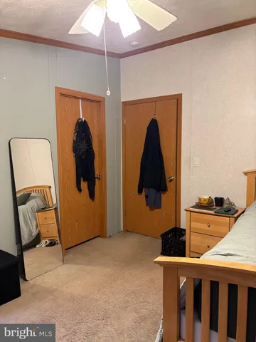 a room with gym equipment and view of living room