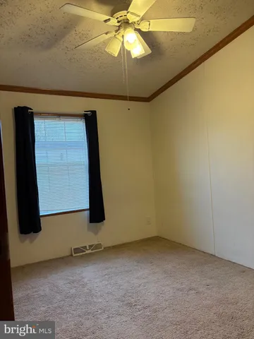 a room with a table and a chandelier