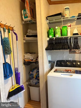 a utility room with sink dryer and washer