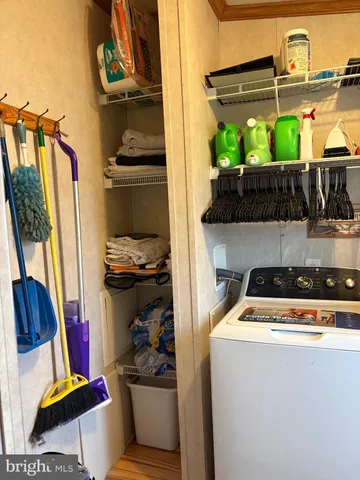 a utility room with sink dryer and washer