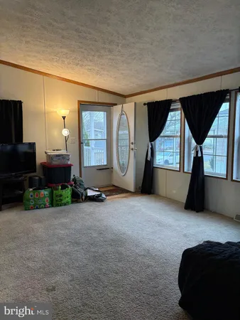 a view of a livingroom with furniture and a fireplace