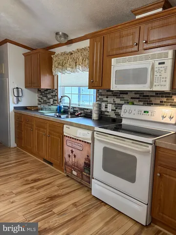 a kitchen with a stove and a microwave oven