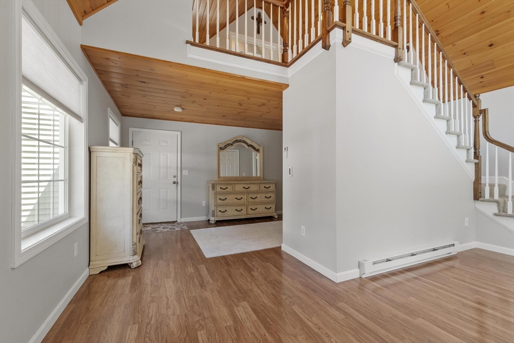 4 Ridge Road Pepperell, MA 01463 - Photo 33 of 42 an entryway with wooden floor and cabinet