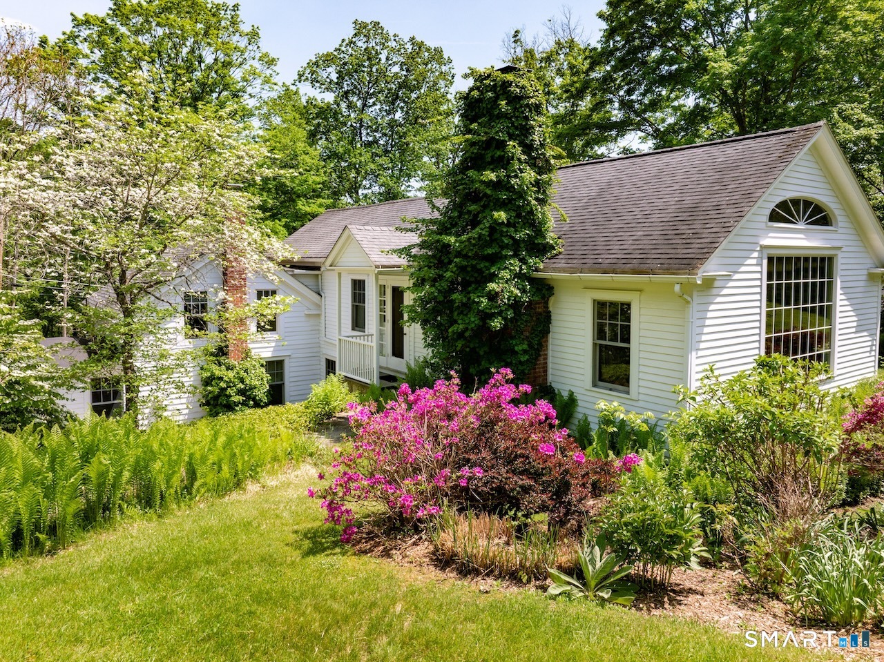 329 Housatonic River Road Salisbury, CT 06031 - Photo 22 of 32 a view of a house with a yard and garden