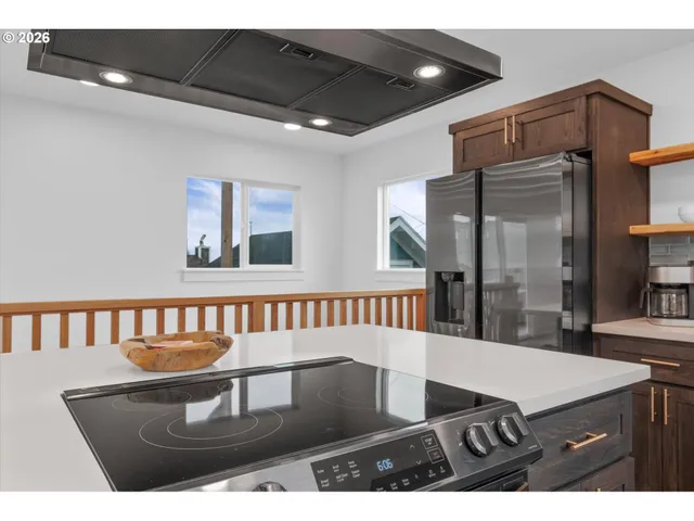 a view of a dining room with furniture and a chandelier