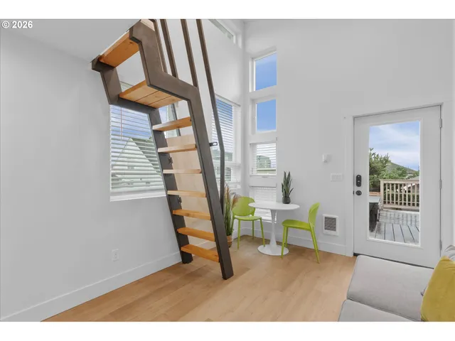 a view of an entryway with wooden floor