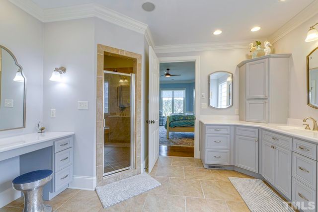 a spacious bathroom with a granite countertop sink mirror and toilet