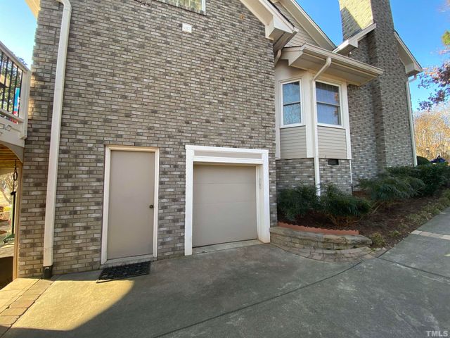 a view of a brick house with windows