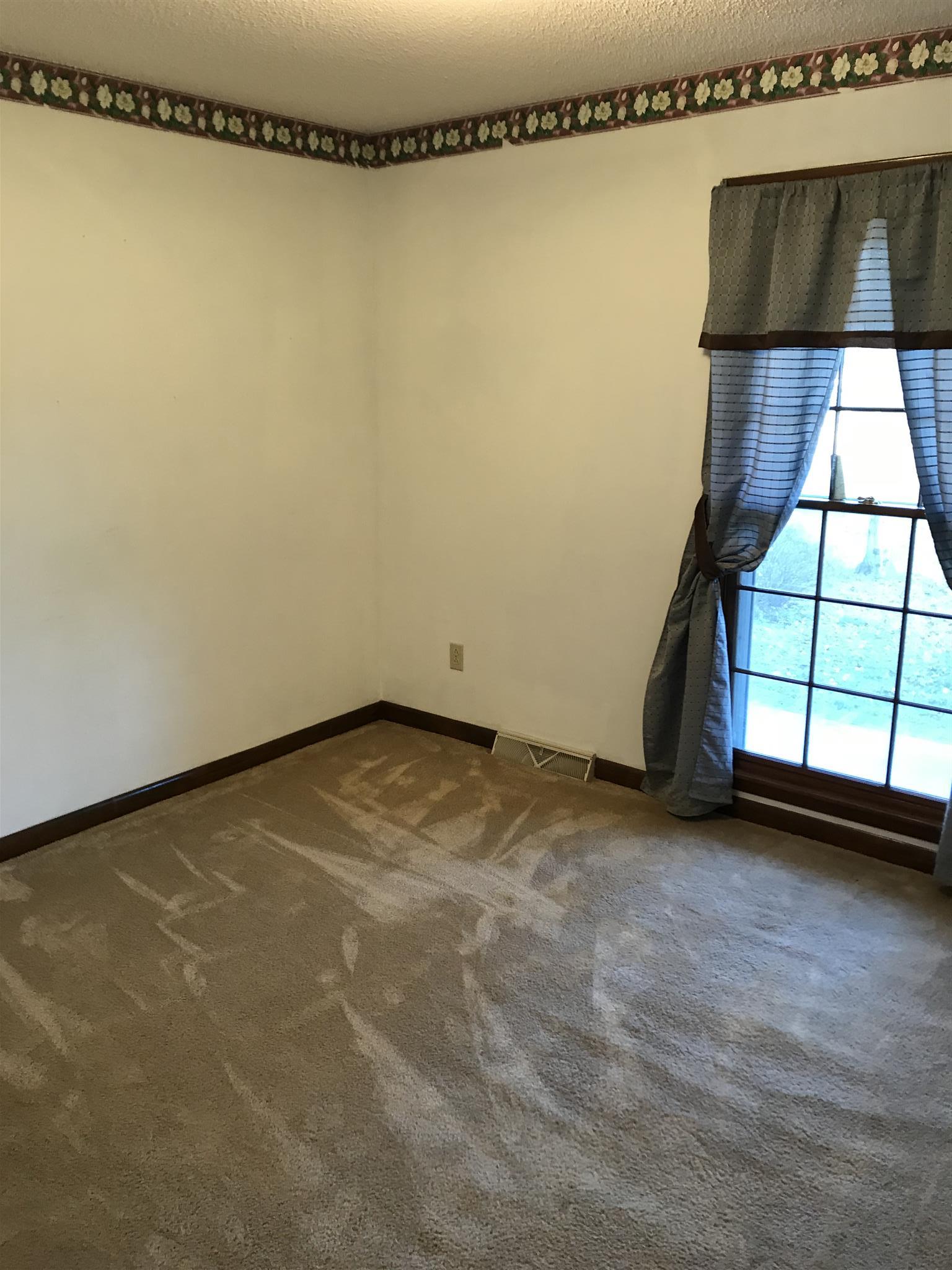 101 Hayes Road Goodspring, TN 38460 - Photo 12 of 22 an empty room with a window
