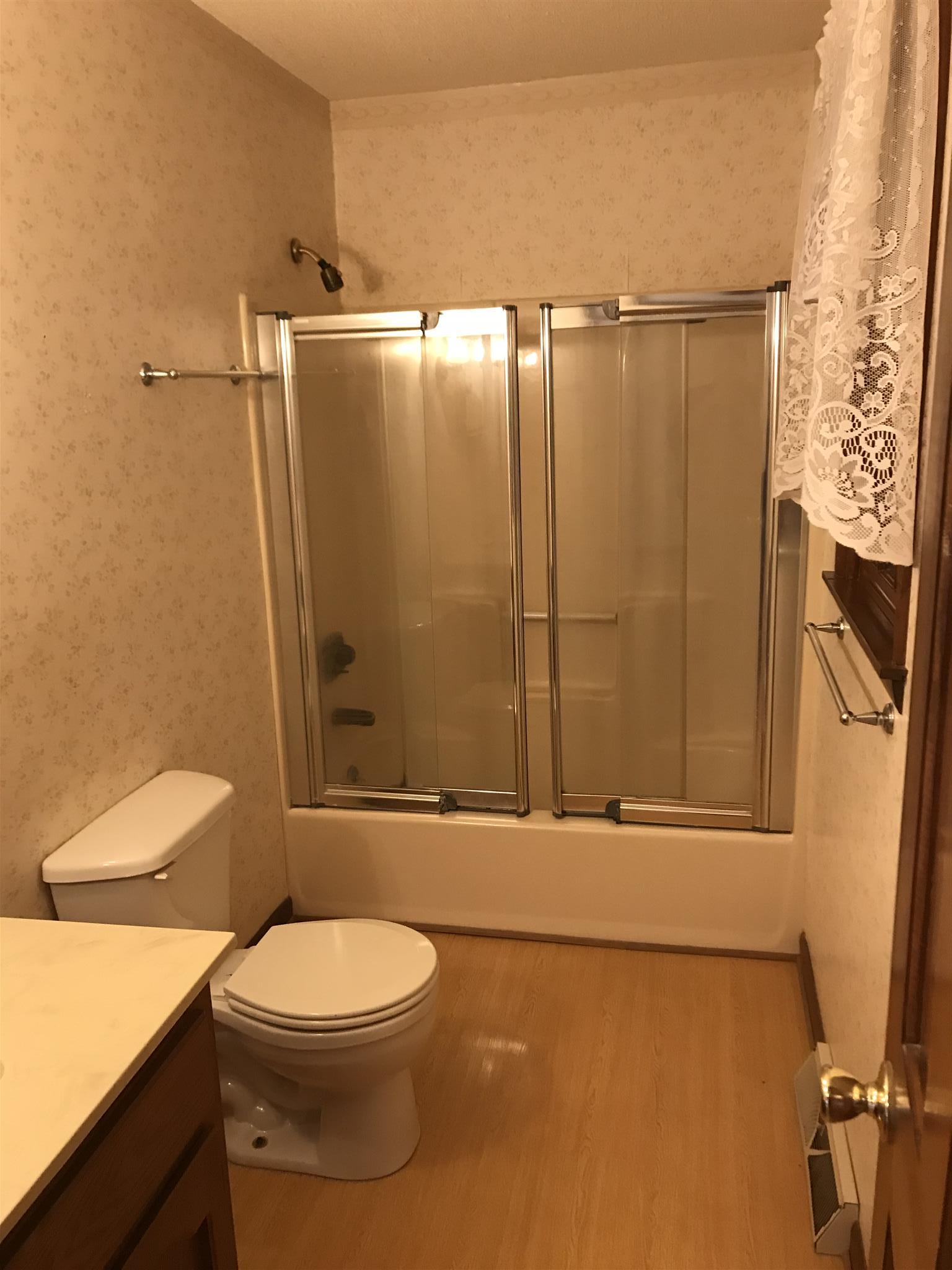 101 Hayes Road Goodspring, TN 38460 - Photo 16 of 22 a bathroom with a toilet a sink and shower