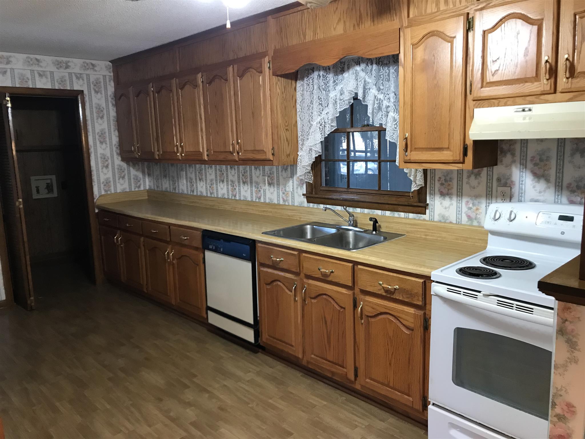 101 Hayes Road Goodspring, TN 38460 - Photo 5 of 22 a kitchen with stainless steel appliances granite countertop a sink stove and cabinets