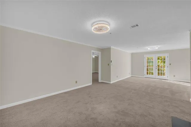 a view of empty room with a fireplace