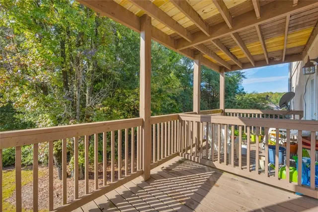 a view of a balcony with wooden floor