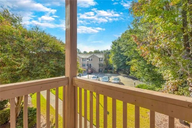 an aerial view of a swimming pool with outdoor seating