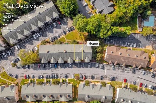 an aerial view of residential building and parking space
