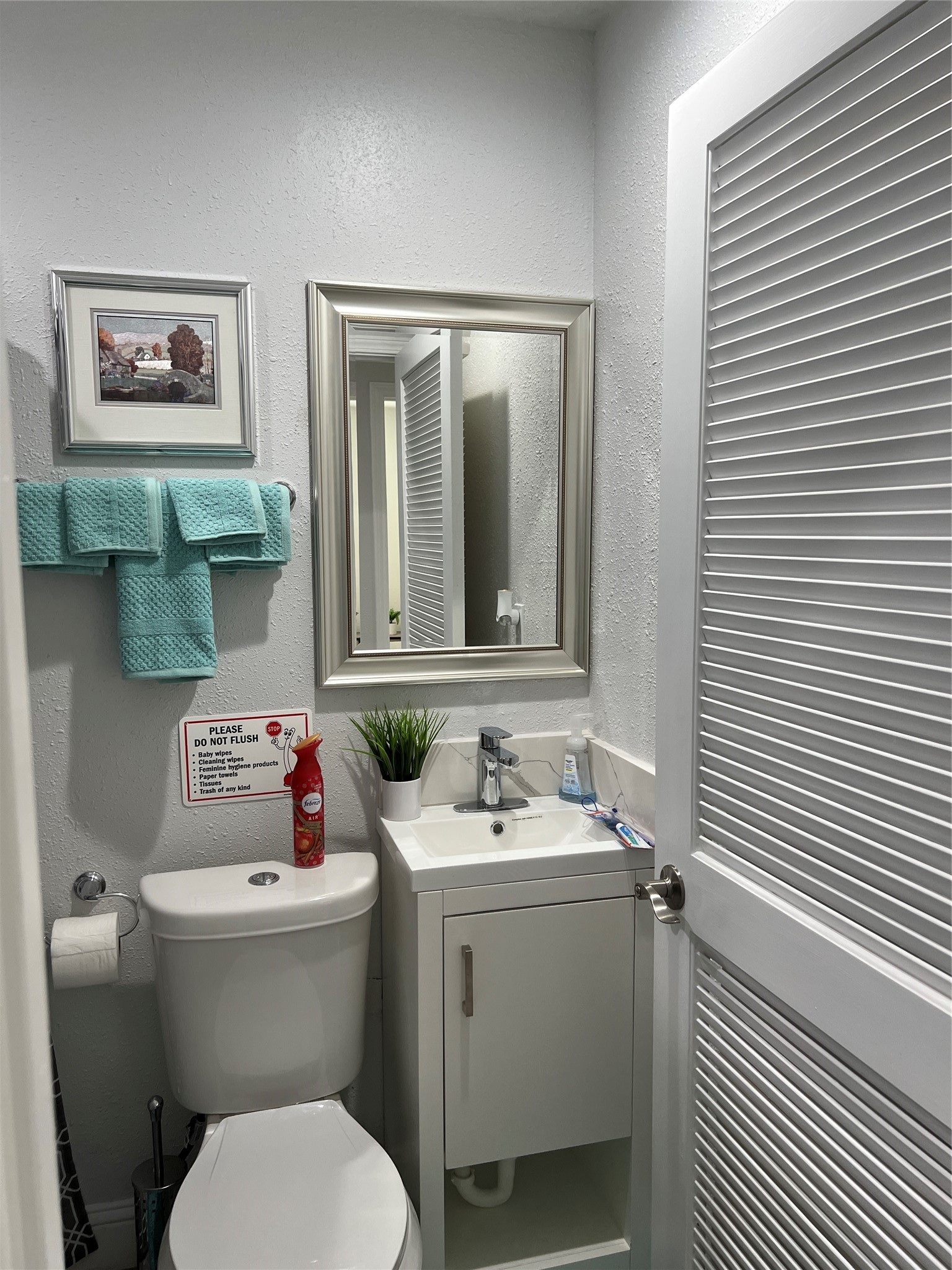 1909 Ruth Street Houston, TX 77004 - Photo 30 of 35 a bathroom with a toilet sink and mirror